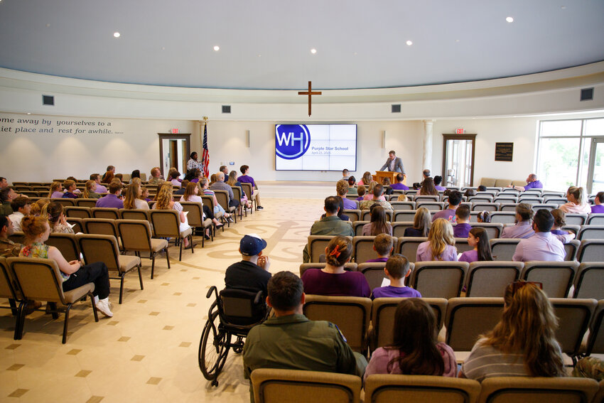 About 100 people participate in Wilson Hall's Purple Star School designation ceremony in the school's Founders Chapel on Wednesday, April 23.