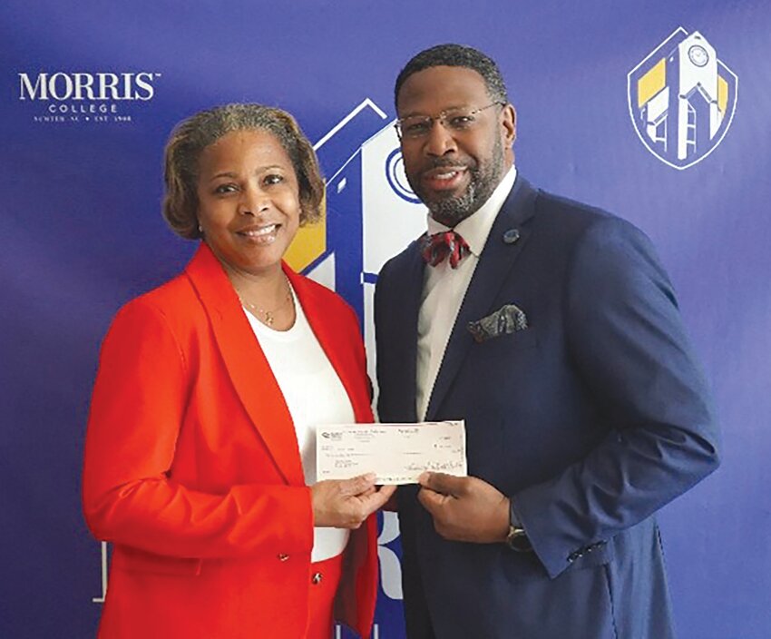 Morris College President Said Sewell accepts a check for $50,000 for the college's STEM programs from Cynthia Bennett, chief operating officer and executive vice president of the South Carolina Chamber of Commerce.