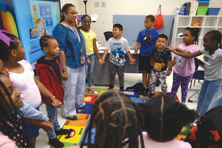 Lemira Elementary School students interact with their classroom teacher on Monday at the school. This spring, Lemira was awarded a Blue Ribbon Schools of Excellence Beacon Award and also was the state's overall winner of the Dick and Tunky Riley Award for School Improvement Council Excellence.