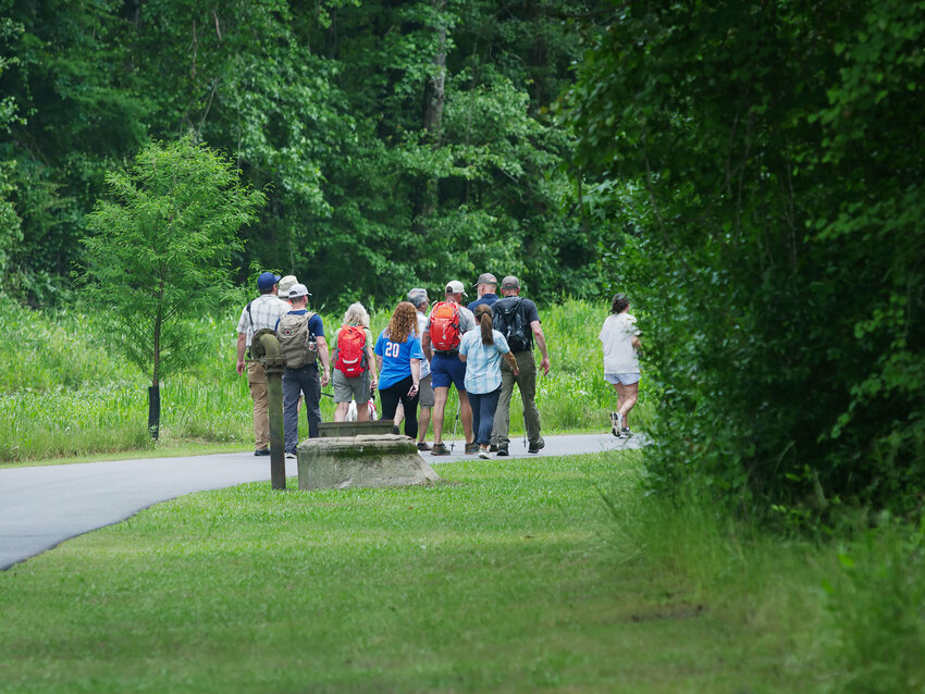 Tom Mullikin of the South Carolina Seven (SC7) walked along Sumter's Shot Pouch Greenway in May 2024 with government officials and members of the public. Join the group for a hike at Poinsett State Park on July 16 or at Swan Lake Iris Gardens later that day.
