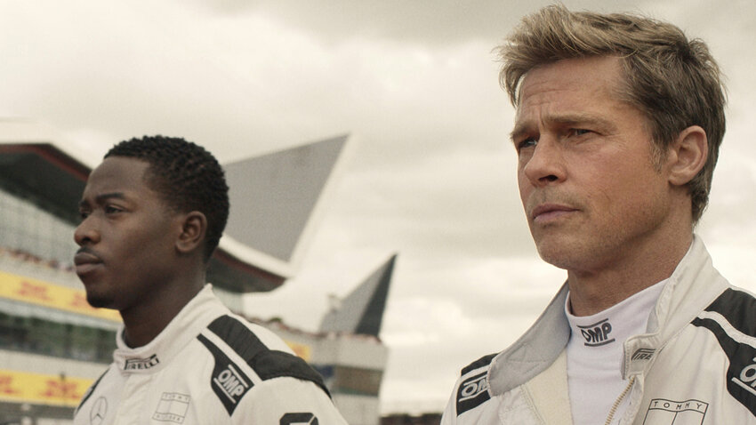 This image released by Apple TV+ shows Damson Idris as Joshua Pearce, left, and Brad Pitt as Sonny Hayes in a scene from &quot;F1 The Movie.&quot;
