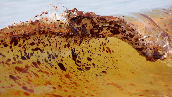 Crude oil from the Deepwater Horizon oil spill washes ashore in Orange Beach, Alabama, in June 2010.