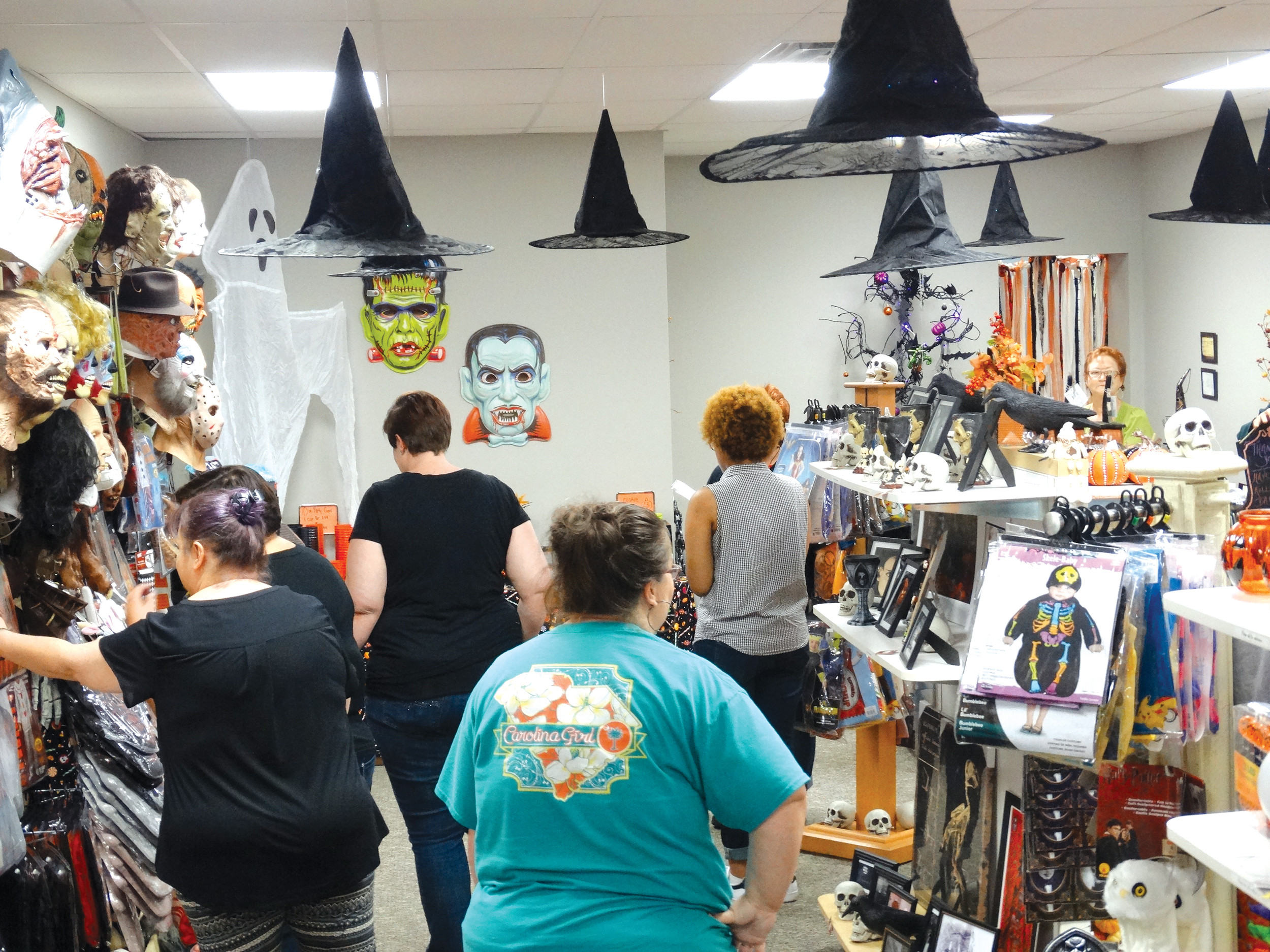 Visitors wander through the shop Tuesday afternoon on West Liberty Street.