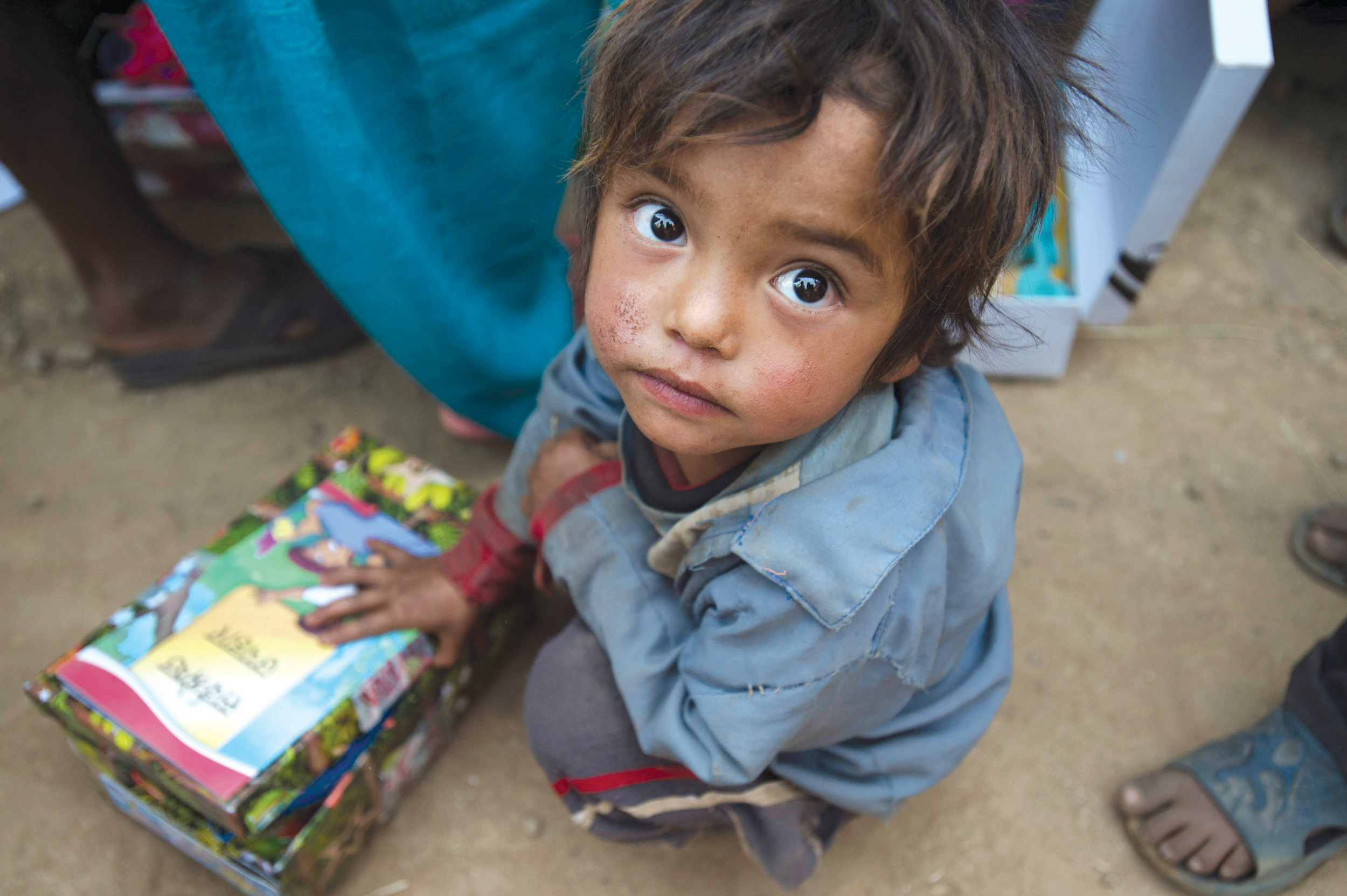 A child in Nepal receives a shoebox gift as part of Operation Christmas Child.