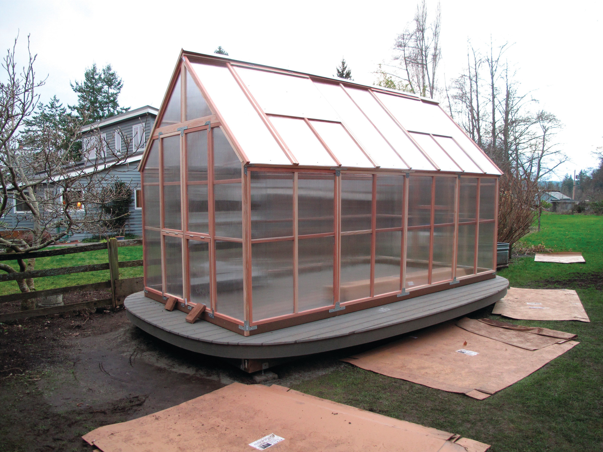 A hobby greenhouse is seen in February in Langley, Washington, built in a sunny location capable of capturing an immense amount of summertime heat. It was later equipped with a timed irrigation system that automatically turns on early in the morning to water a wide assortment of potted plants. Smart devices are being introduced to make gardening less demanding and more efficient.
