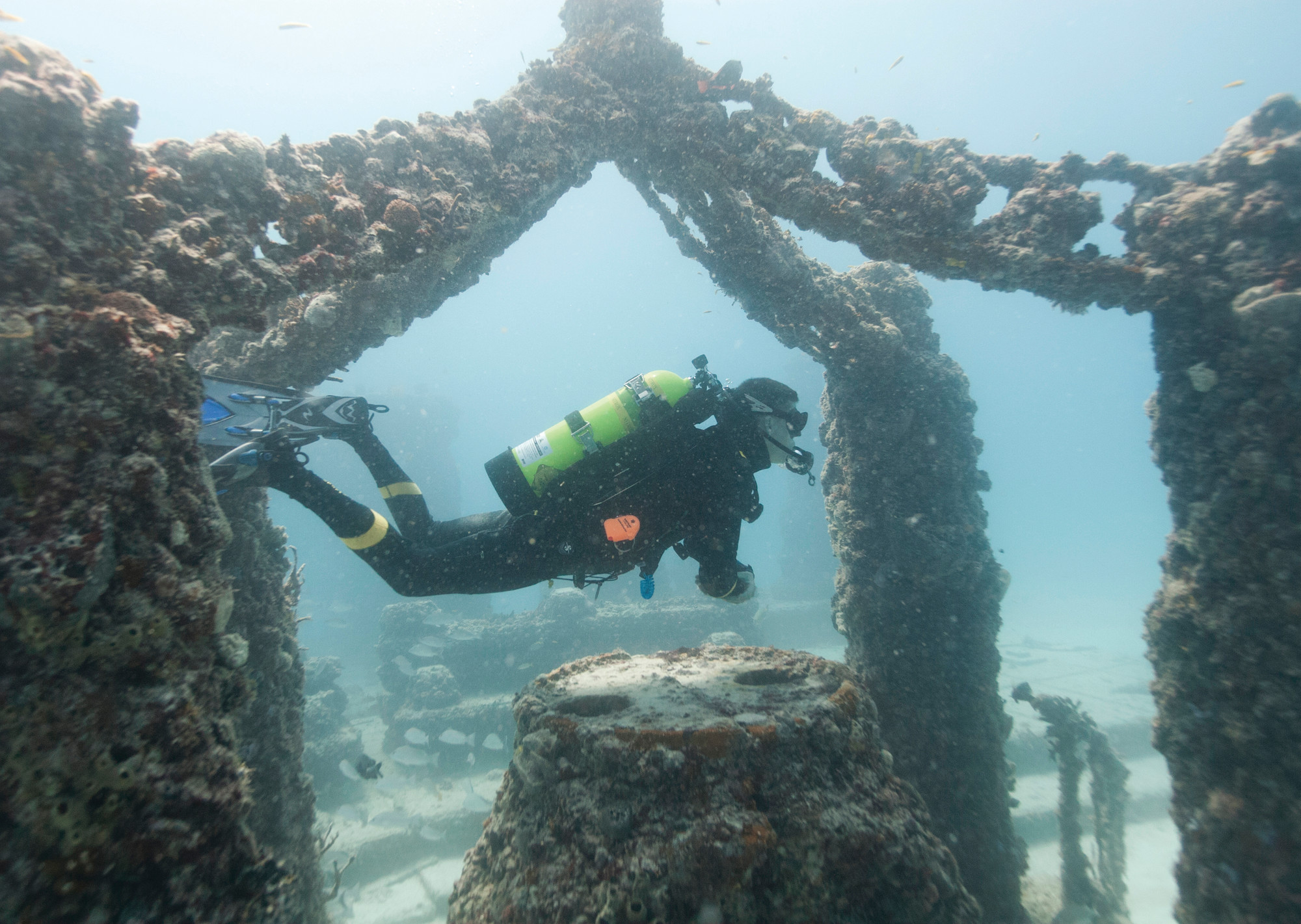PHOTOS BY THE ASSOCIATED PRESS Ray Lowenstein with Neptune Memorial Reef gives a tour of the site near Miami Beach, Florida. The Neptune Memorial Reef, an underwater cemetery modeled after the lost city of Atlantis, is undergoing a massive expansion. The concrete structures provide a base for coral to get a head start and offer a high pH level, enabling sea creatures to flourish.