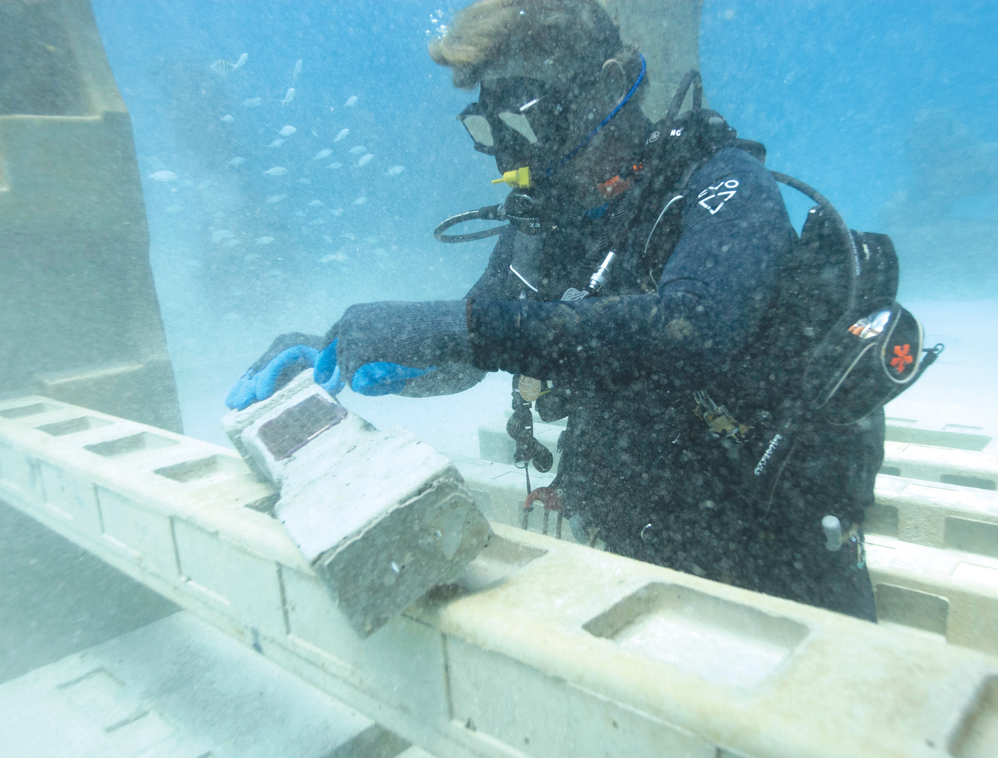 Jim Hutslar, operations director for Neptune Memorial Reef, prepares to install a memorial plaque for Buel and Linda Payne, affixed to a cement baluster mixed with their ashes, at the Neptune Memorial Reef near Miami Beach. The cemetery is already home to the cremated remains of about 1,500 people and is welcoming thousands more seeking life in the afterlife.