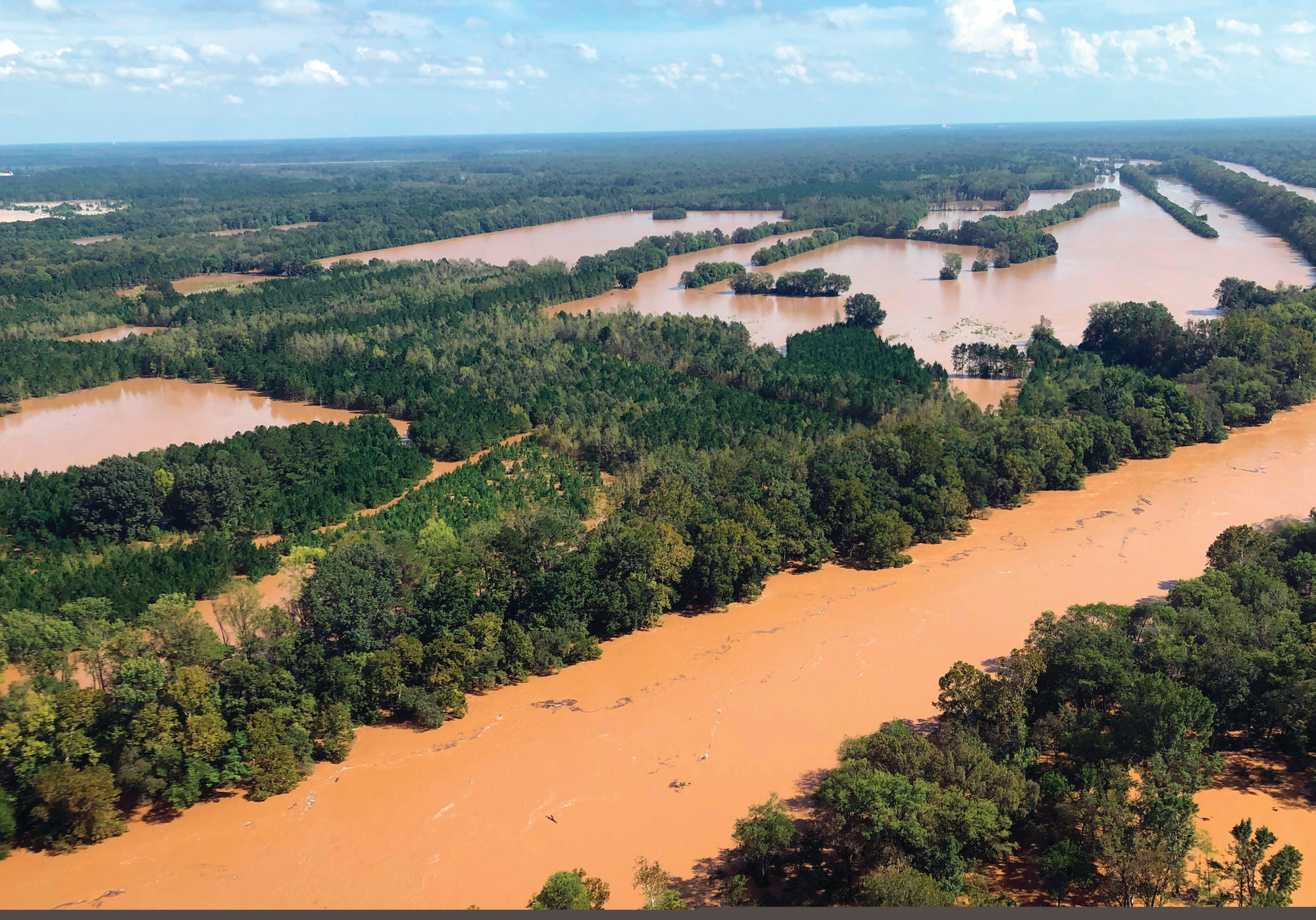 This Monday, Sept. 17, 2018, photo shows rising flood waters in the Pee Dee area in Marion County, S.C. Two female mental health patients detained for medical transport drowned Tuesday, Sept. 18, when a sheriff's department van was swept away in rising floodwaters, according to authorities.