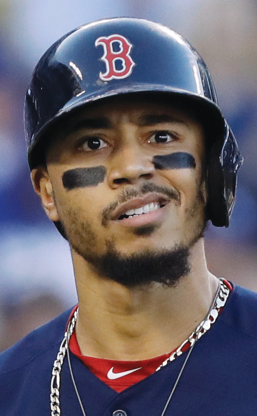 Boston Red Sox's Mookie Betts grimaces after striking out to Los Angeles Dodgers' pitcher Walker Buehler during the first inning in Game 3 of the World Series baseball game on Friday, Oct. 26, 2018, in Los Angeles. (AP Photo/David J. Phillip)