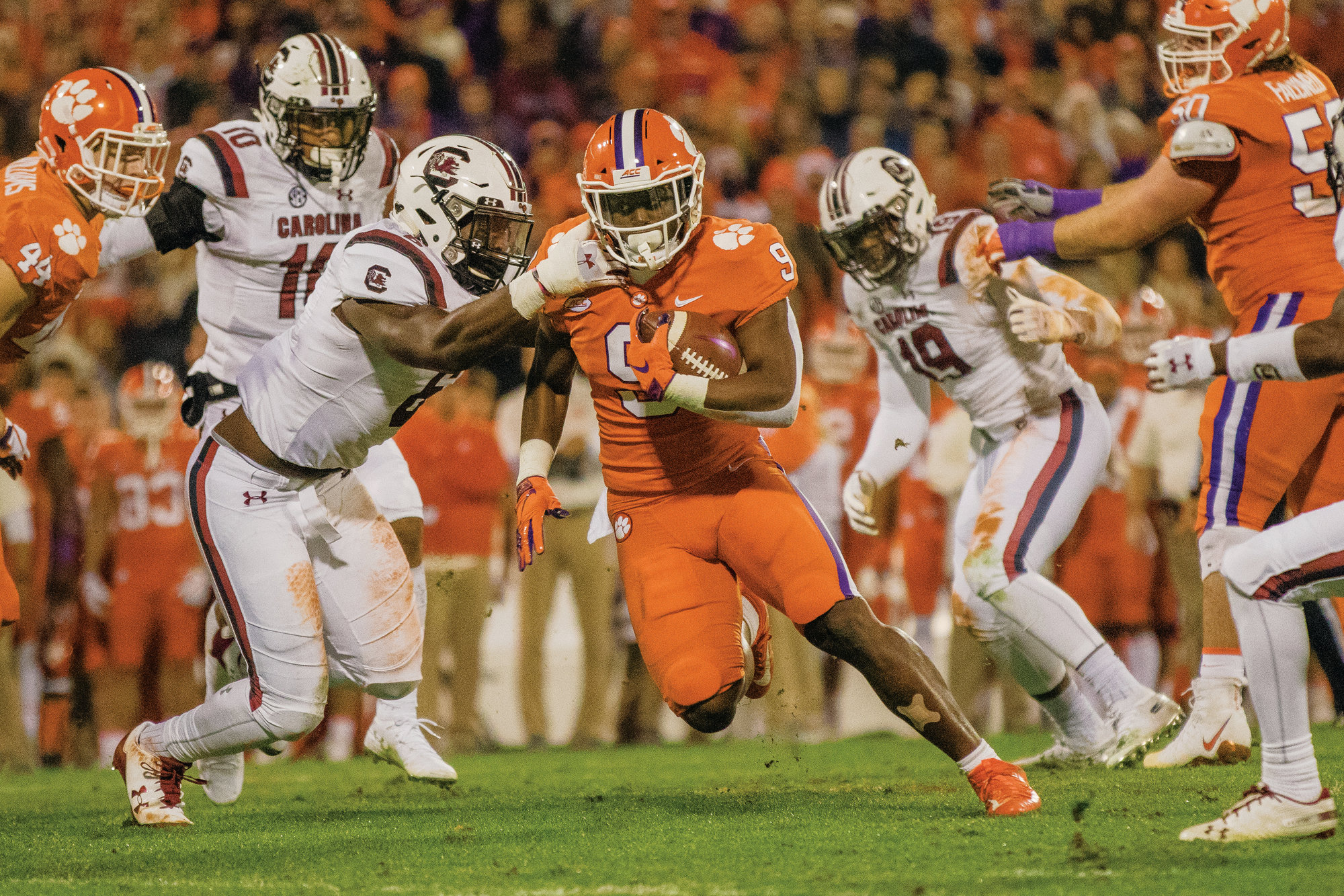 MICAH GREEN / THE SUMTER ITEM  Clemson running back Travis Etienne (9) runs the ball during the Tigers' 56-35 victory over South Carolina earlier this season in Clemson. Etienne earned ACC Offensive Player of the Year honors for his 2018 performance, joining 10 other Tigers on the All-ACC teams.
