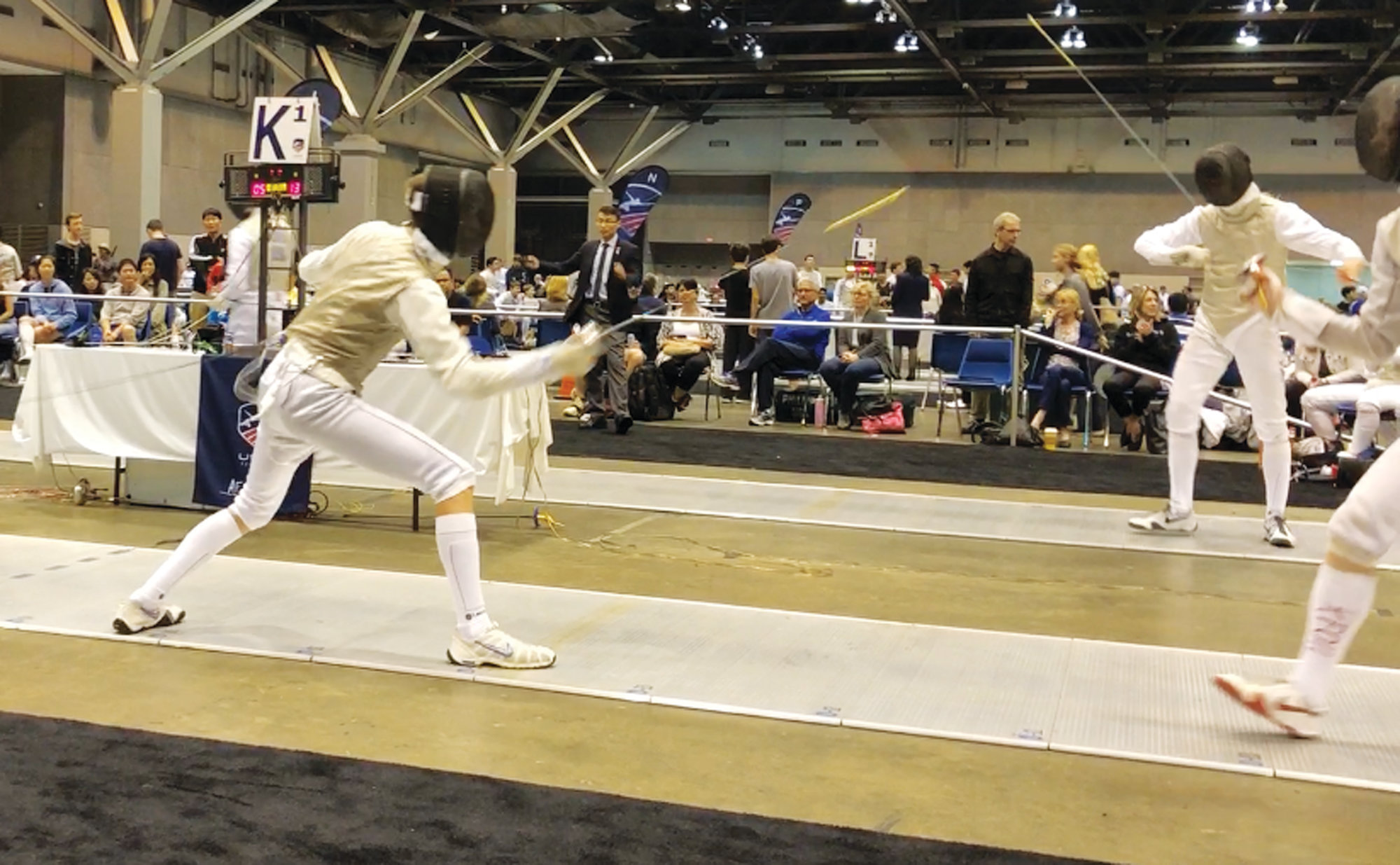 Wilson Hall senior Luke Kinney, left, competes last year at the 2018 USA Fencing National Championships in St. Louis, Missouri.