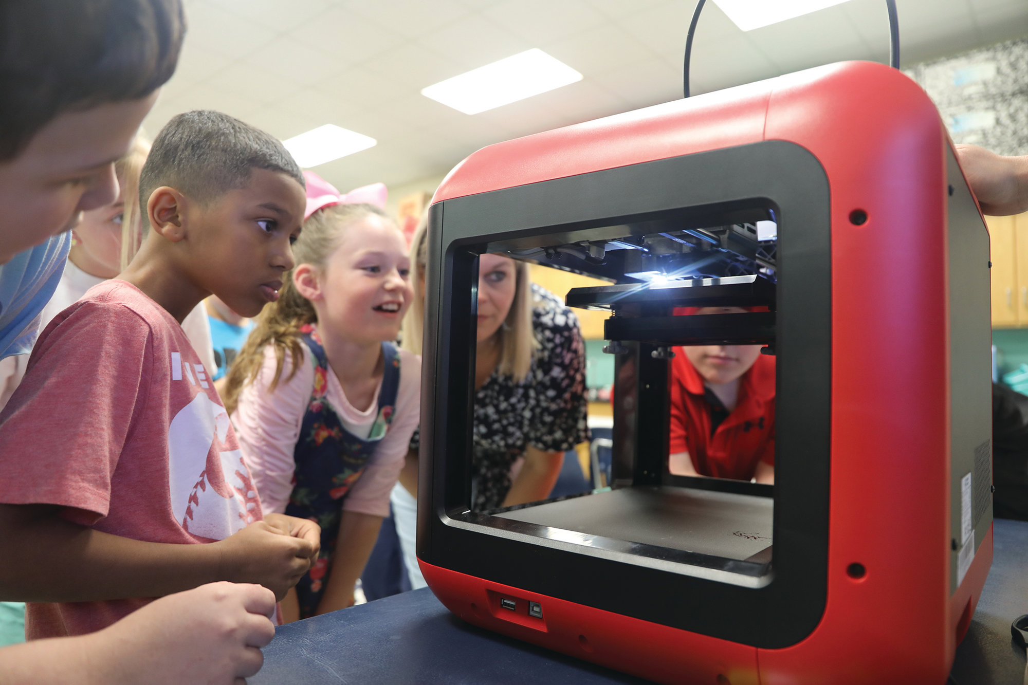 Alice Drive Elementary School teacher Lisa Jackson's fourth-grade class visited Kristi Waldron's STEM classroom lab to see how the new 3-D printer from Central Carolina Technical College works.