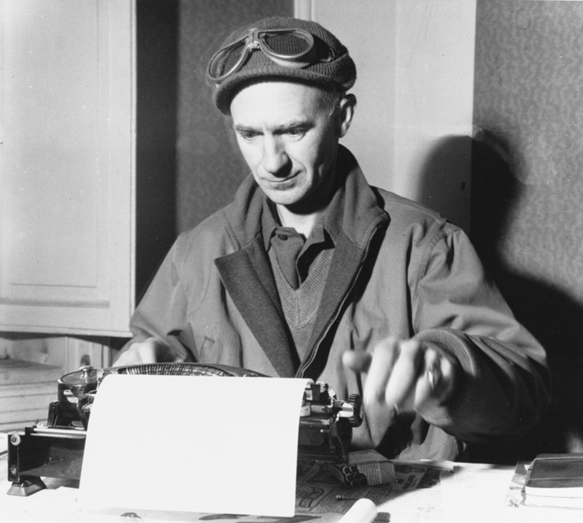 Ernie Pyle works on an article while visiting the Anzio Beachhead on March 18, 1944.
