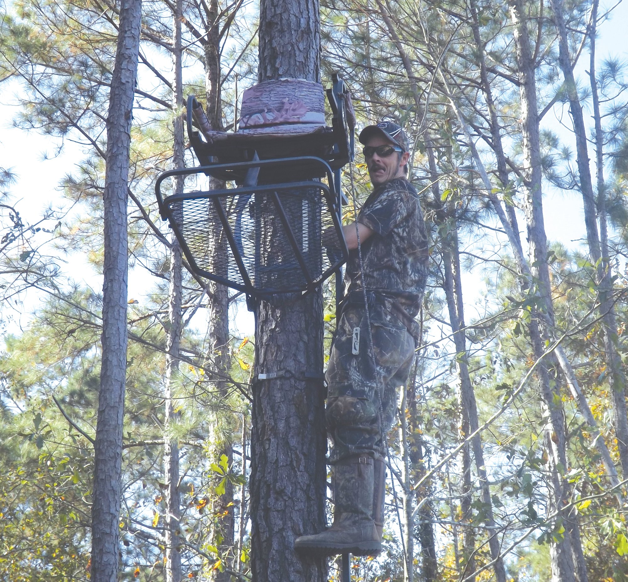 Clayton Geddings checks out a deer stand before the season starts.