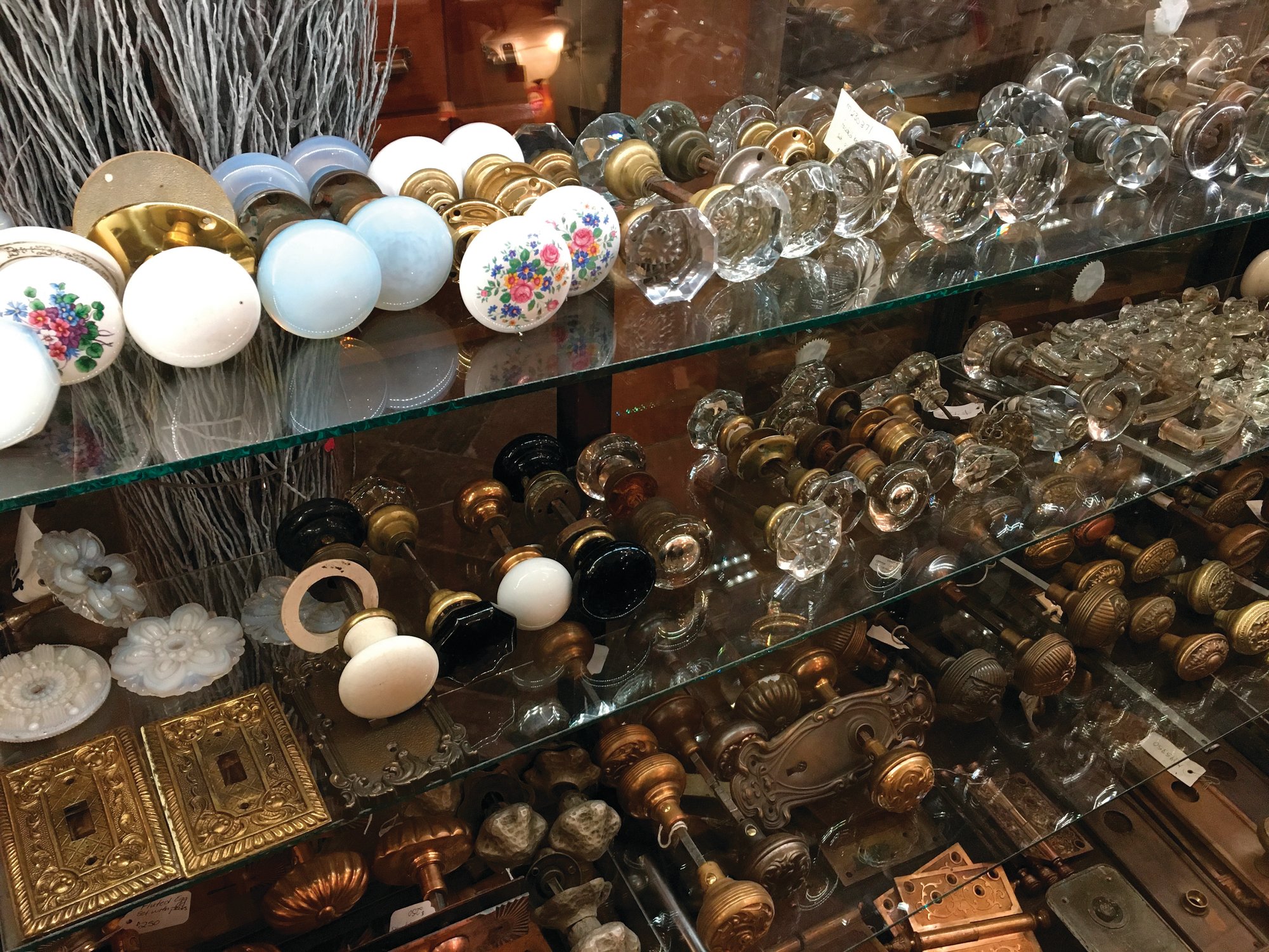 PHOTOS BY KATHERINE ROTH VIA AP Seen is a selection of vintage doorknobs and other items available for sale at Olde Good Things salvage store in New York.