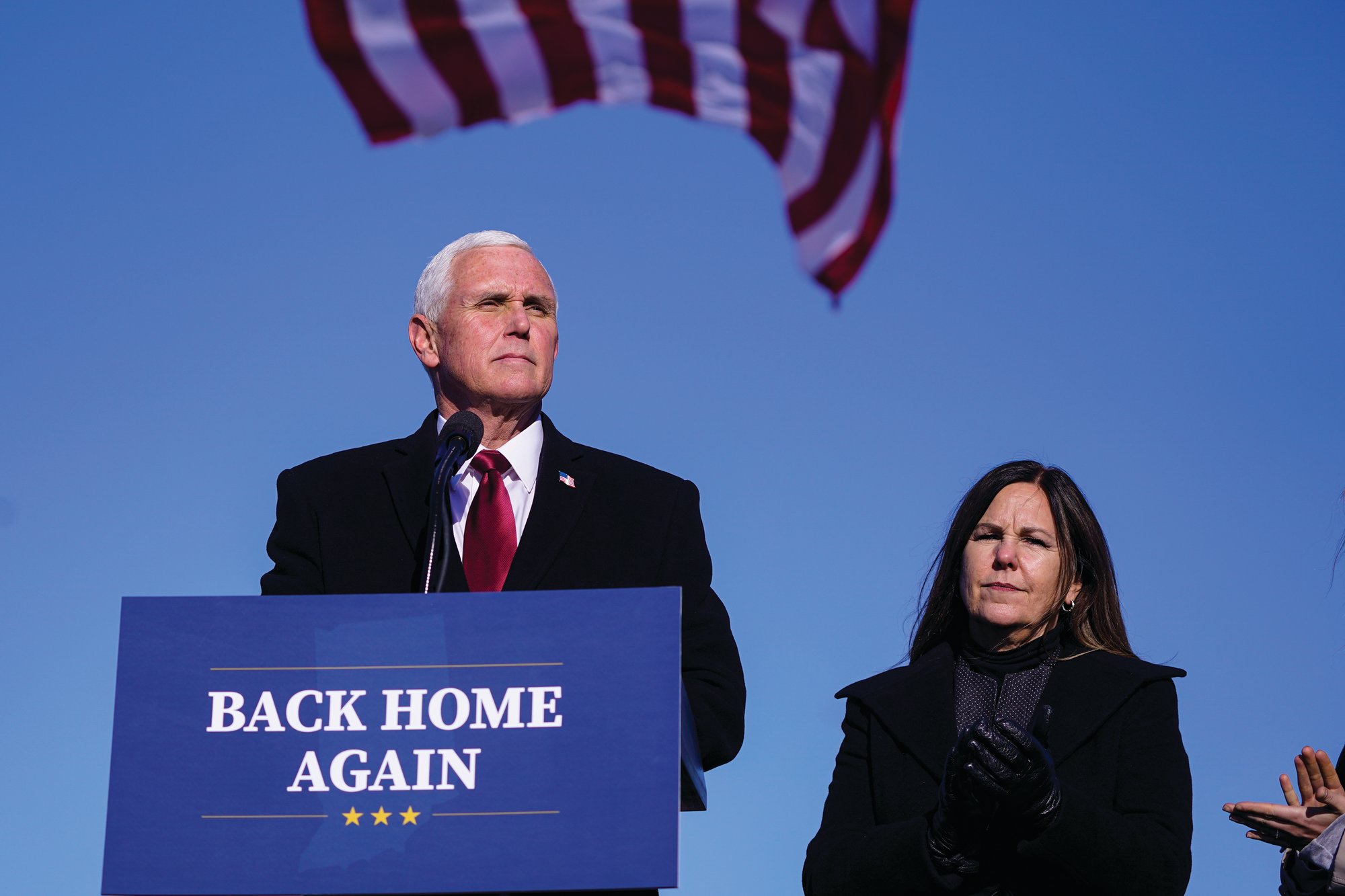 In this Jan. 20, 2021, file photo, former Vice President Mike Pence speaks after arriving back in his hometown of Columbus, Indiana, as his wife Karen watches.