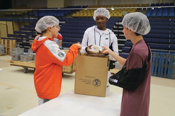 From left, Gray Sanders, TyJae Blair and Shep Vincent set prepared meals for overseas in a box Saturday at "One Weekend" at Sumter County Civic Center. A total of 13 churches across Sumter participated in the discipleship weekend that leads into the Tony Evans Sumter Crusade, which is tonight through Thursday at the civic center. Music begins each night at 6:30 p.m. The crusade is a free event with no tickets required, but people are advised to arrive early.