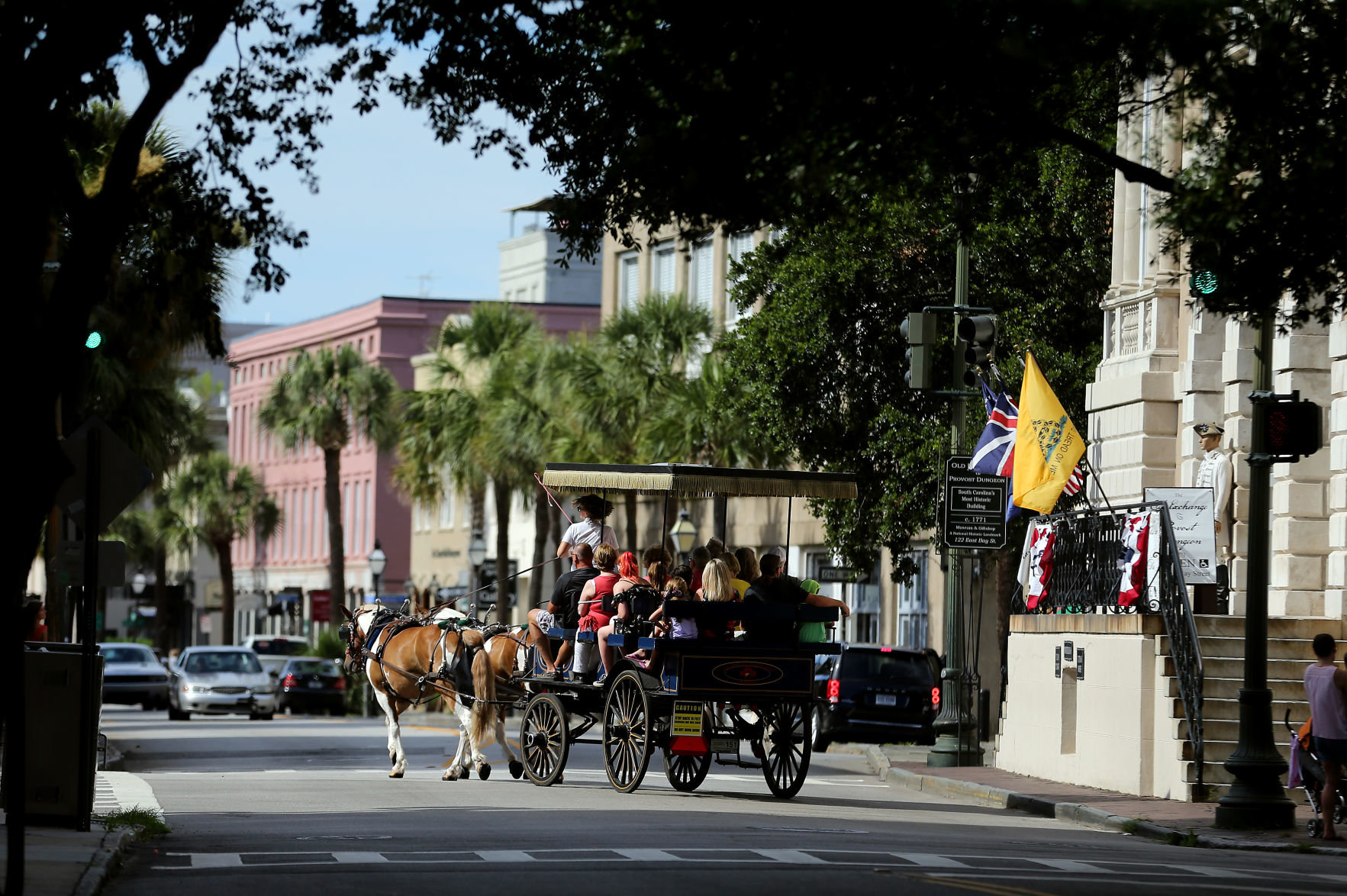 A horse carriage takes visitors past the Old Exchange Building in Charleston in 2018. Readers of Travel + Leisure magazine have picked Charleston for the top spot in The Top 15 Cities in the United States for several years.