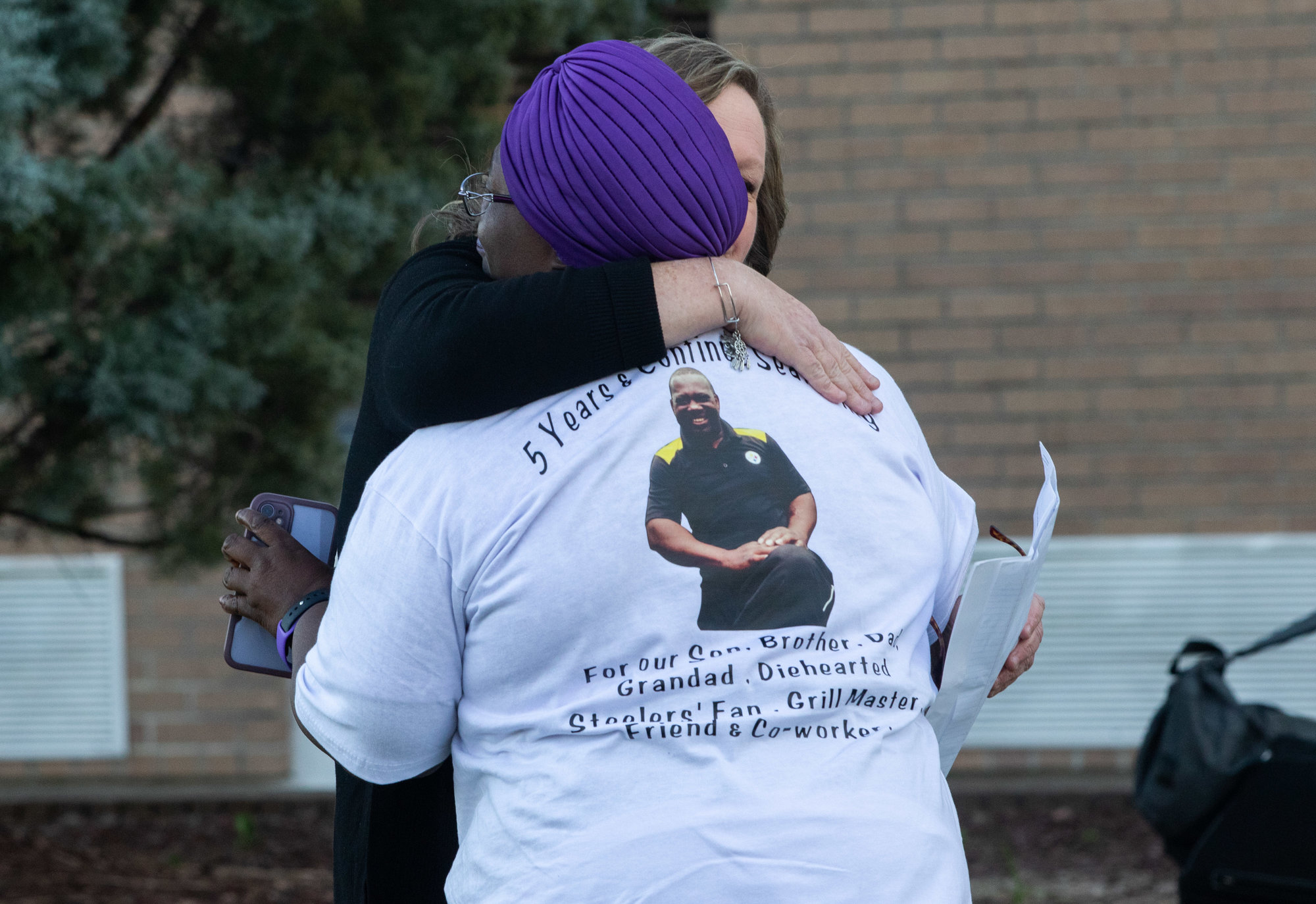 Staci Mitchum and Shelia Brailey embrace at the Sumter's Missing memorial on Nov. 13, 2022.