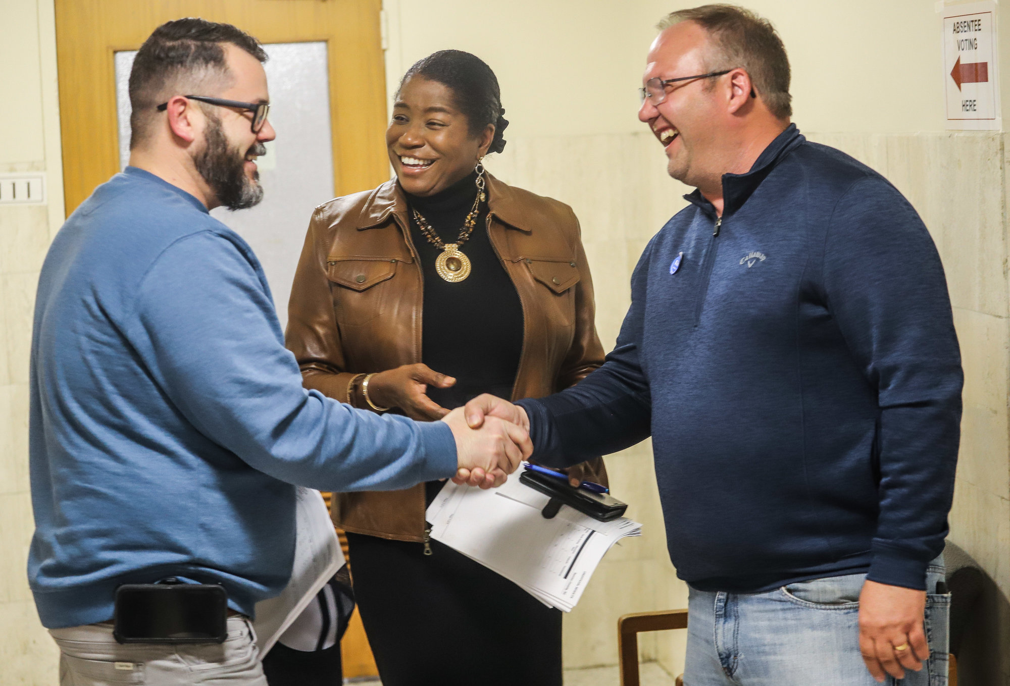 From left, Jeff Zell, District 8, Tarah Cousar Johnson, District 4, and Daniel Palumbo, District 1, congratulate each other on their election wins at the Sumter County Courthouse on Tuesday night.