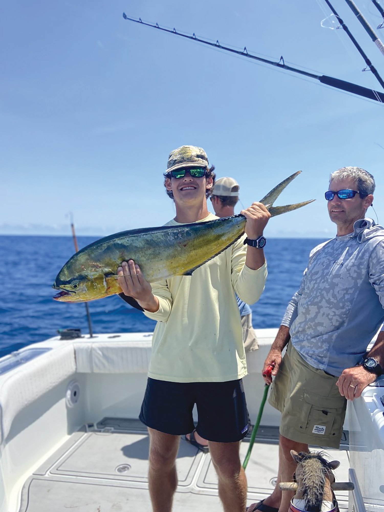 Charlie Noonan holds up the world-record pompano dolphinfish he caught in June 2022 off the North Carolina coast. The fish weighed 11.5 pounds.
