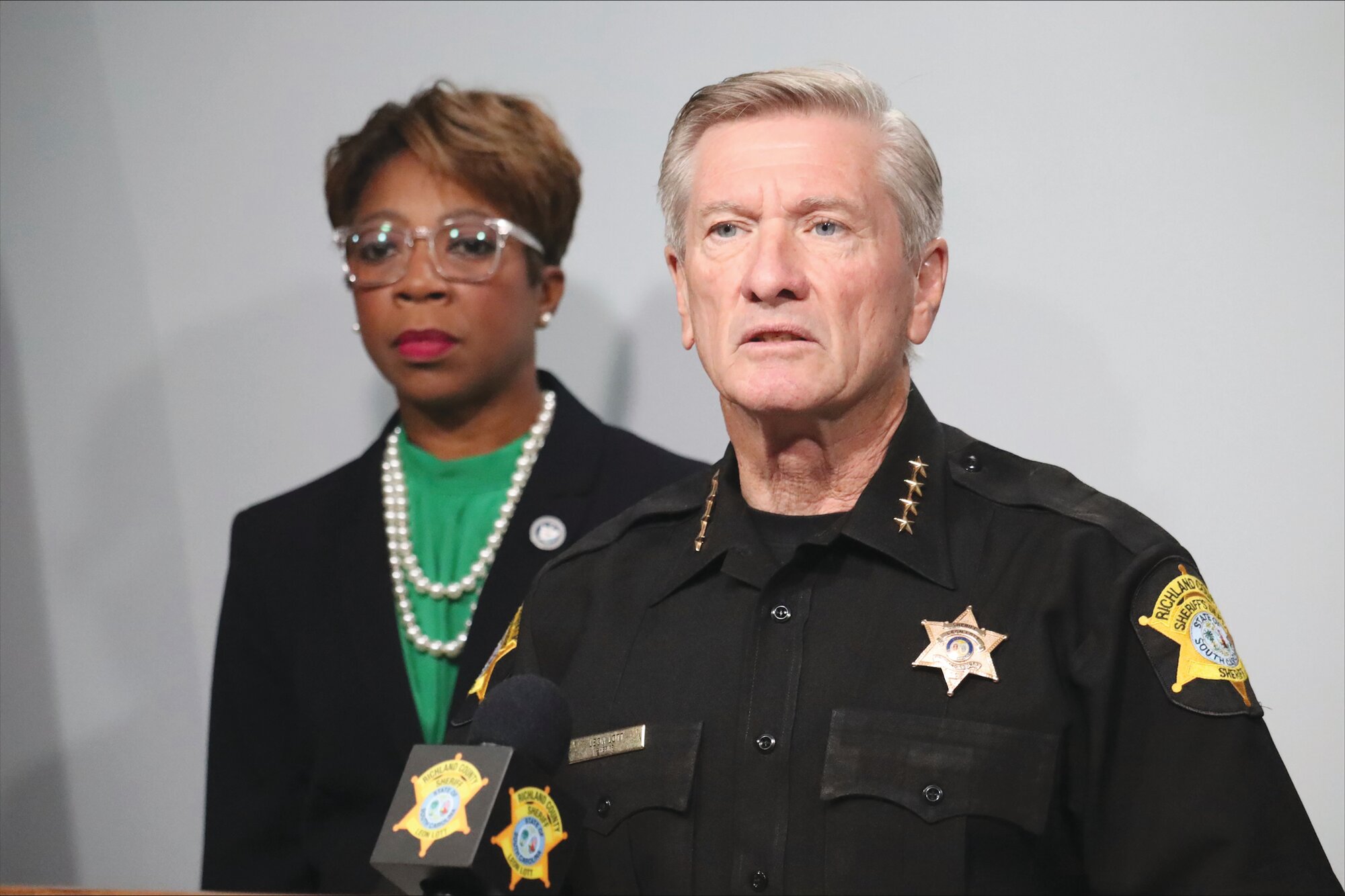 ASSOCIATED PRESS  Richland County Sheriff Leon Lott, right, and council member Gretchen Barron speak at a news conference on Monday, Sept. 25, in Columbia about a shooting Sunday that killed three teenagers.