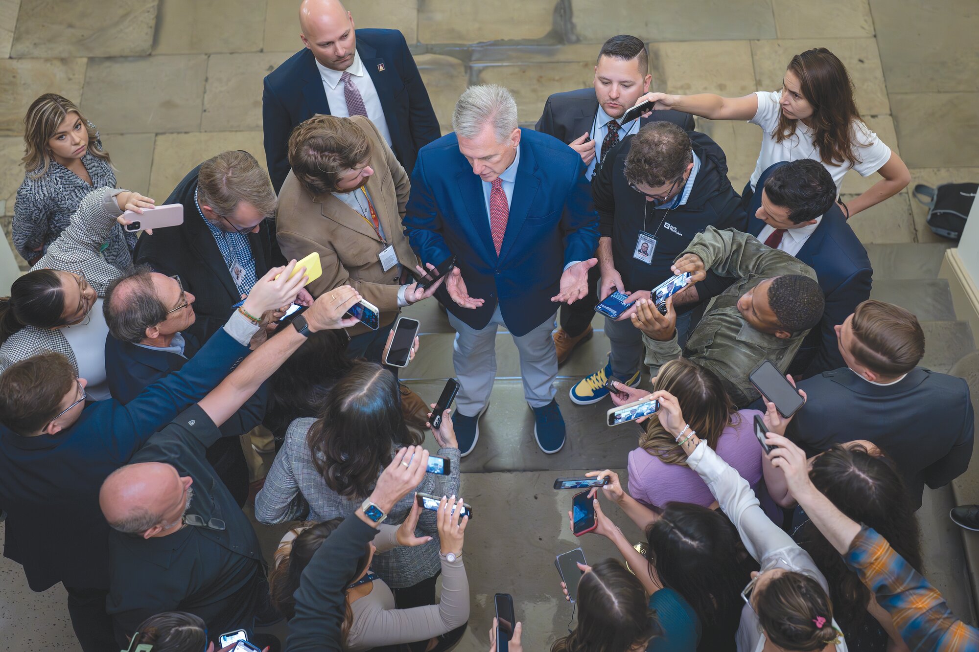 Speaker of the House Kevin McCarthy, R-Calif., is surrounded by reporters looking for updates on plans to fund the government and avert a shutdown, at the Capitol in Washington, Friday, Sept. 22, 2023.