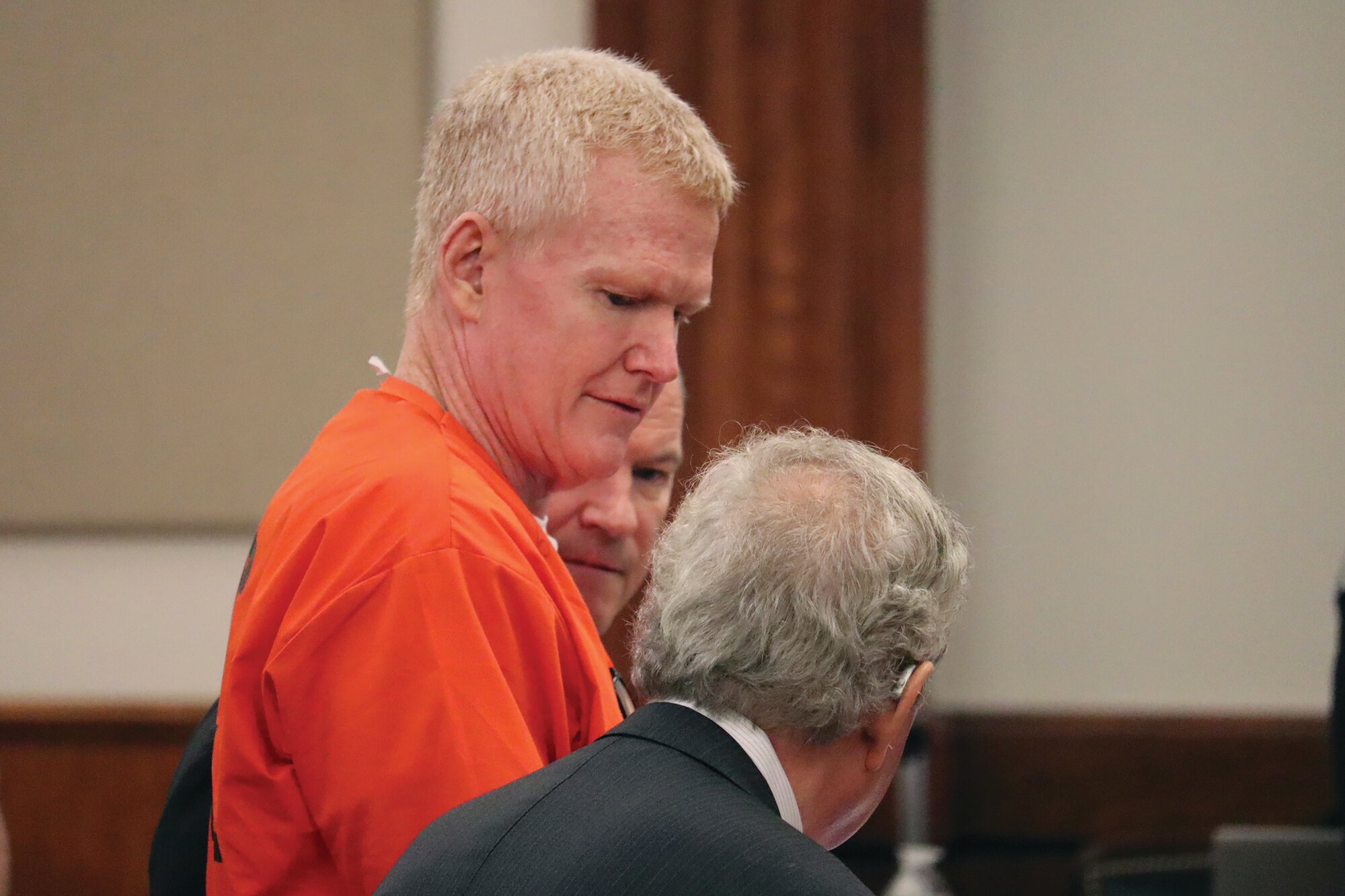 Convicted murderer Alex Murdaugh speaks with his defense attorney, Dick Harpootlian, in Beaufort, S.C. on Friday, Nov. 17, 2023. A pretrial hearing is scheduled Friday on state charges that Murdaugh stole money from his legal clients.