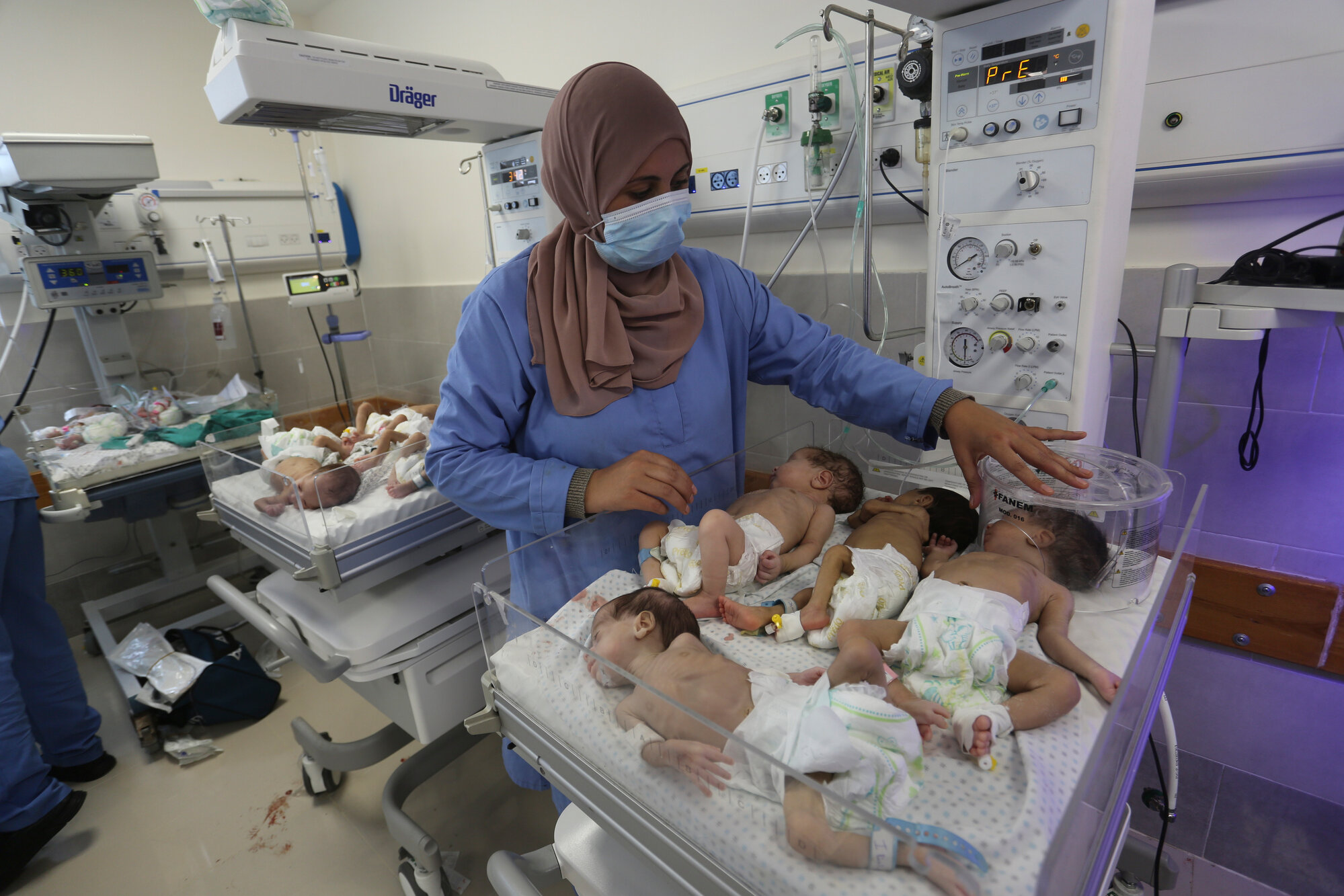 A nurse cares for prematurely born Palestinian babies that were brought from Shifa Hospital in Gaza City to the hospital in Rafah, Gaza Strip, Sunday, Nov. 19, 2023.