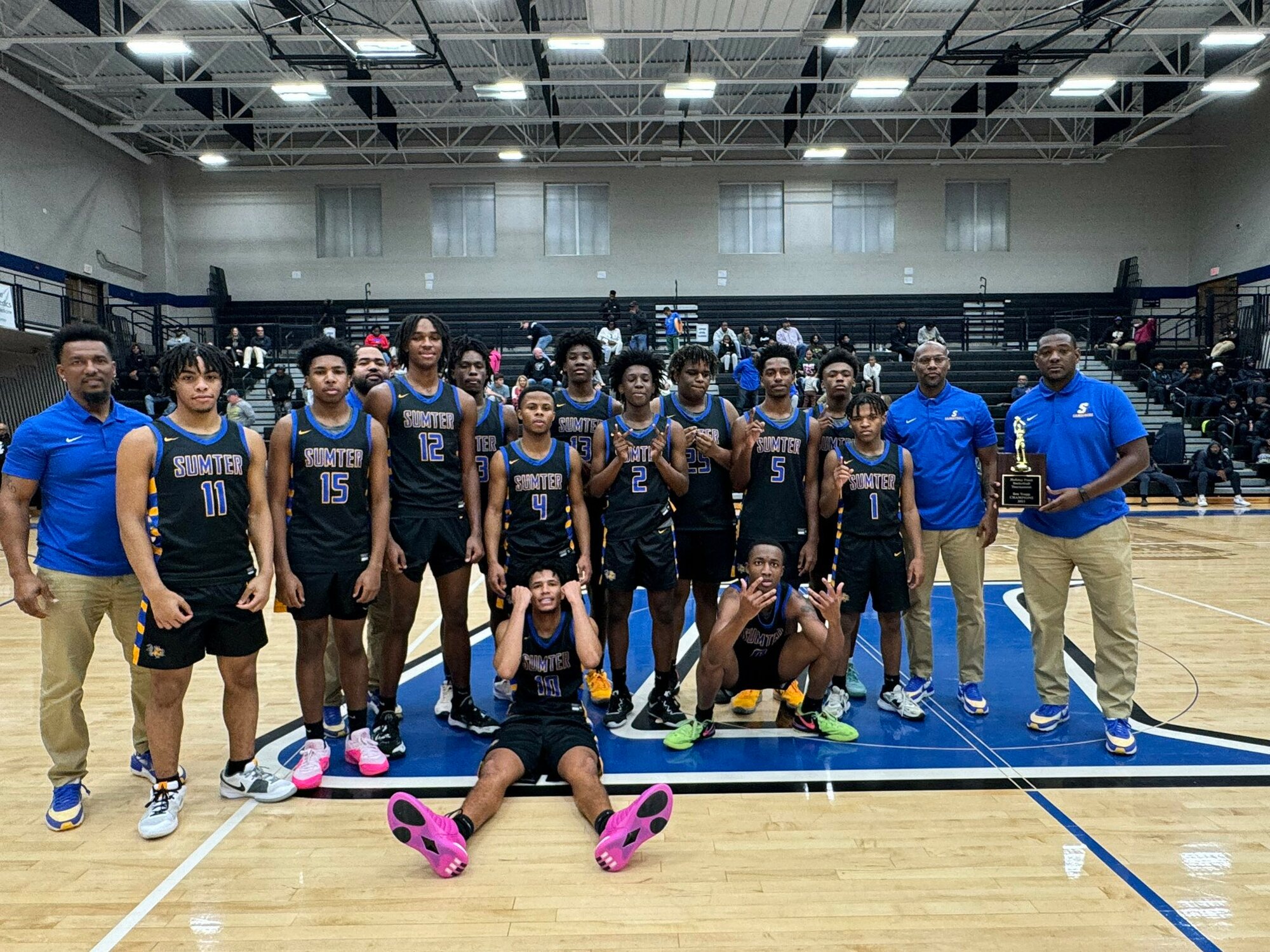The Sumter High basketball team celebrates their win over South Pointe on Friday.