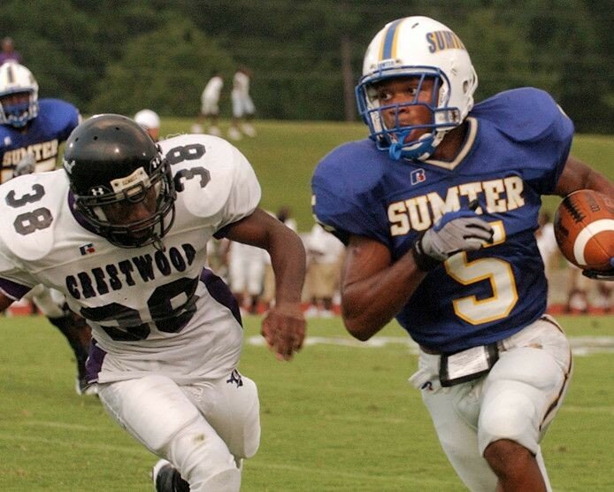 Former Sumter High running back Roderick McDowell (5) carries the ball against Crestwood during his senior season for the Gamecocks.