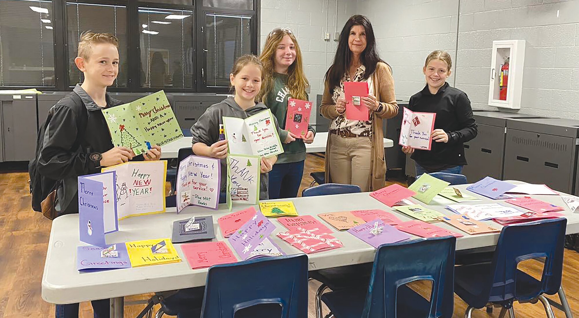 In 2022, The Blue Star Hawks, Alice Drive Middle School's military kids club, put the finishing touches on more than 30 handmade cards that were part of the Shower Shaw with Goodies program.