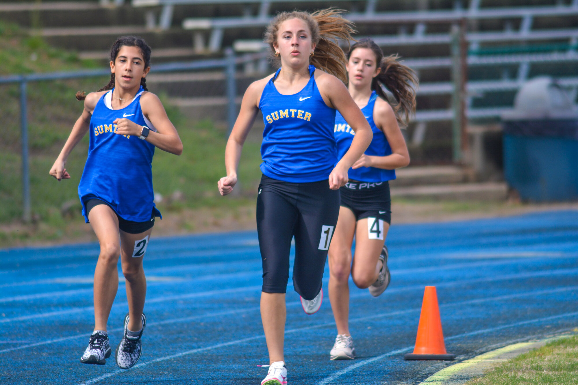 Sumter High's Molly Smith, left, and Emily Vipperman, center, both had top 15 finishes in both the 1,600m and 3,200m runs at the Bob Jenkins Coaches Classic on Saturday, March 23.