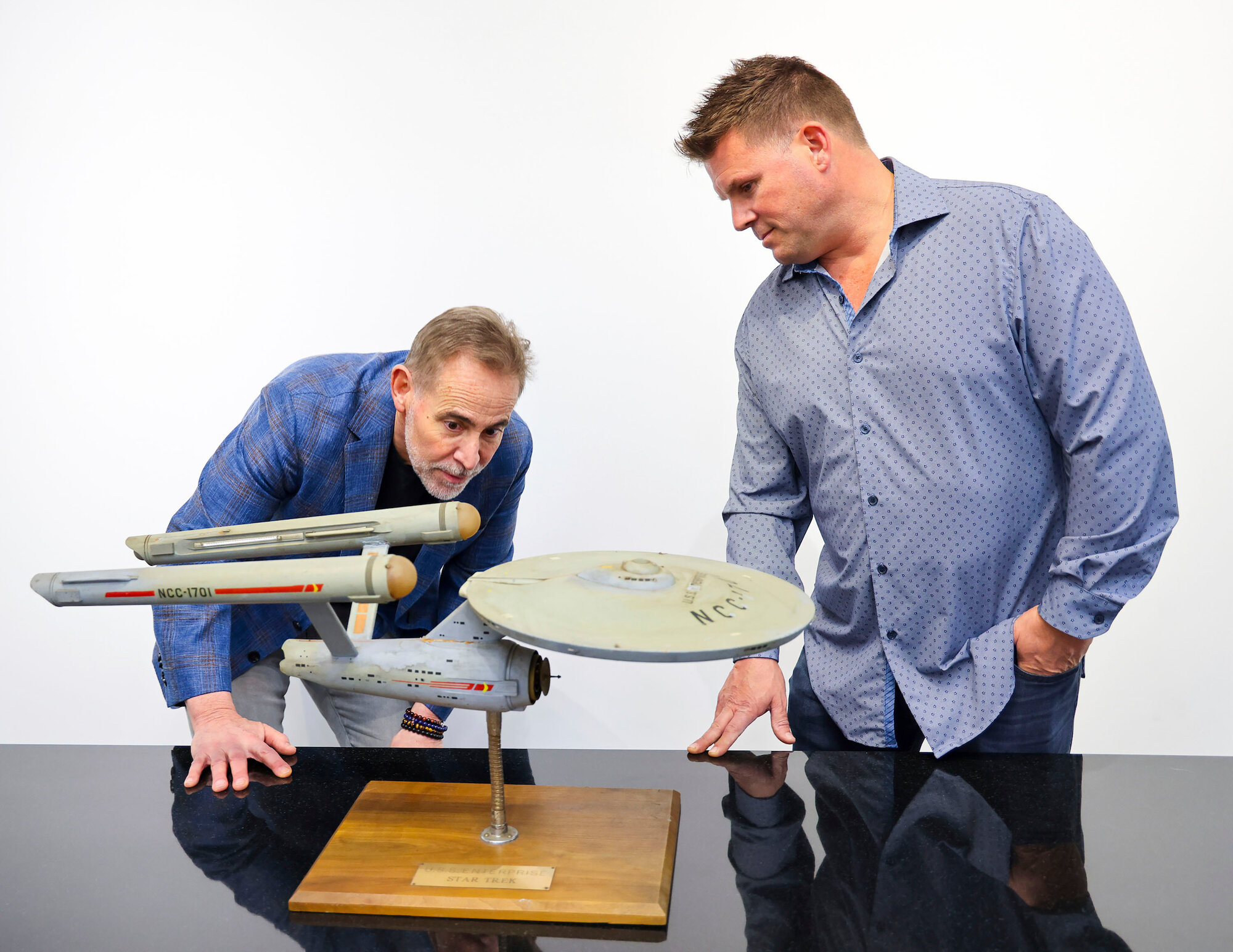 Joe Maddalena, executive vice president of Heritage Auctions, left, and Eugene "Rod" Roddenberry, the son of "Star Trek" creator Gene Roddenberry, view the recently recovered first model of the USS Enterprise at Heritage Auctions in Los Angeles on April 13. The model - used in the original "Star Trek" TV series - has been returned to Gene, decades after it went missing in the 1970s.