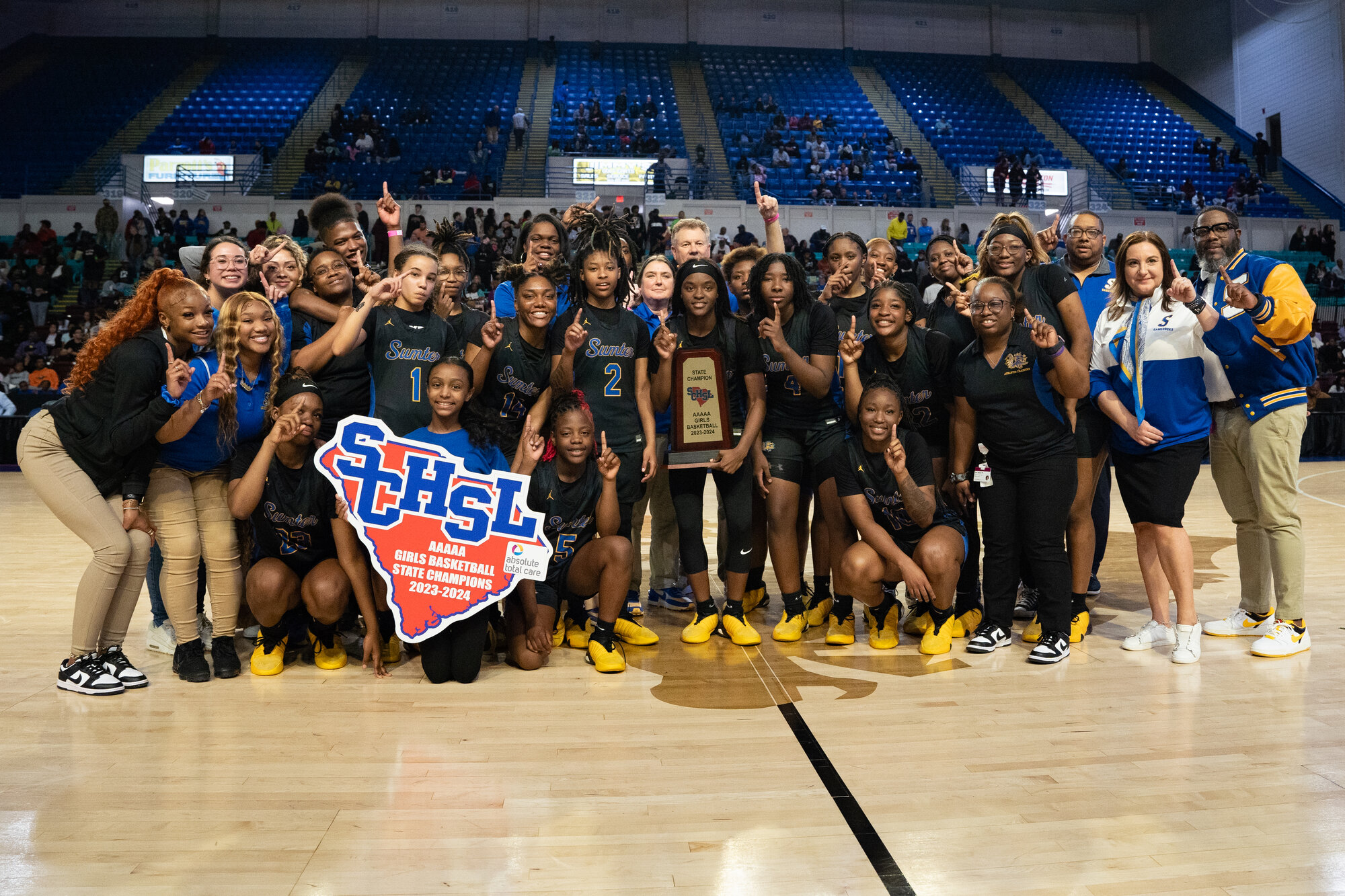 The Sumter High girls basketball team celebrates the SCHSL 5A state championship on Mar. 1 at the Florence Center. For the next two years SCHSL 5A will name two state champions in every sport, splitting the classification between larger and smaller schools for the postseason.