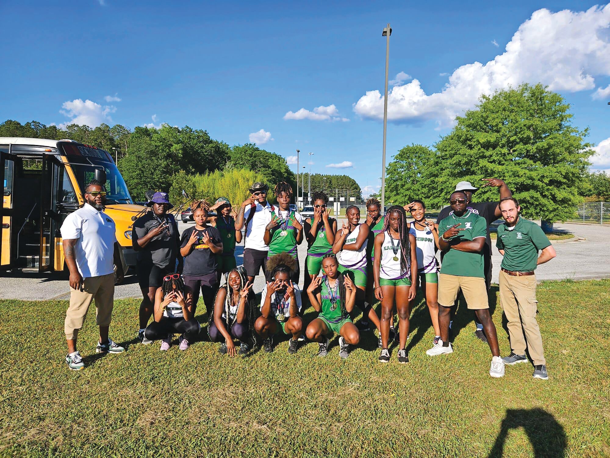 Members of the Lakewood track teams celebrate their performances at the Region VI-3A meet. The boys team won and the girls team came in second.