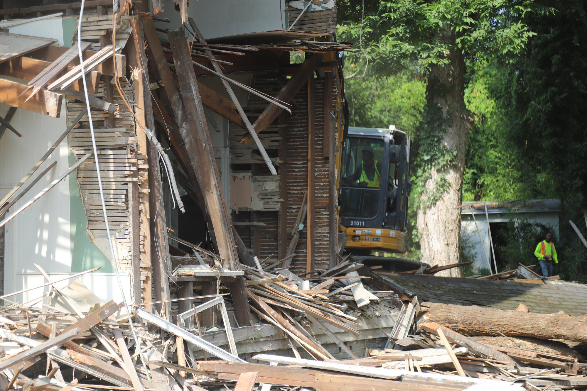A four-bedroom, three-bathroom home at 410 Church St. is demolished on Friday, June 28.