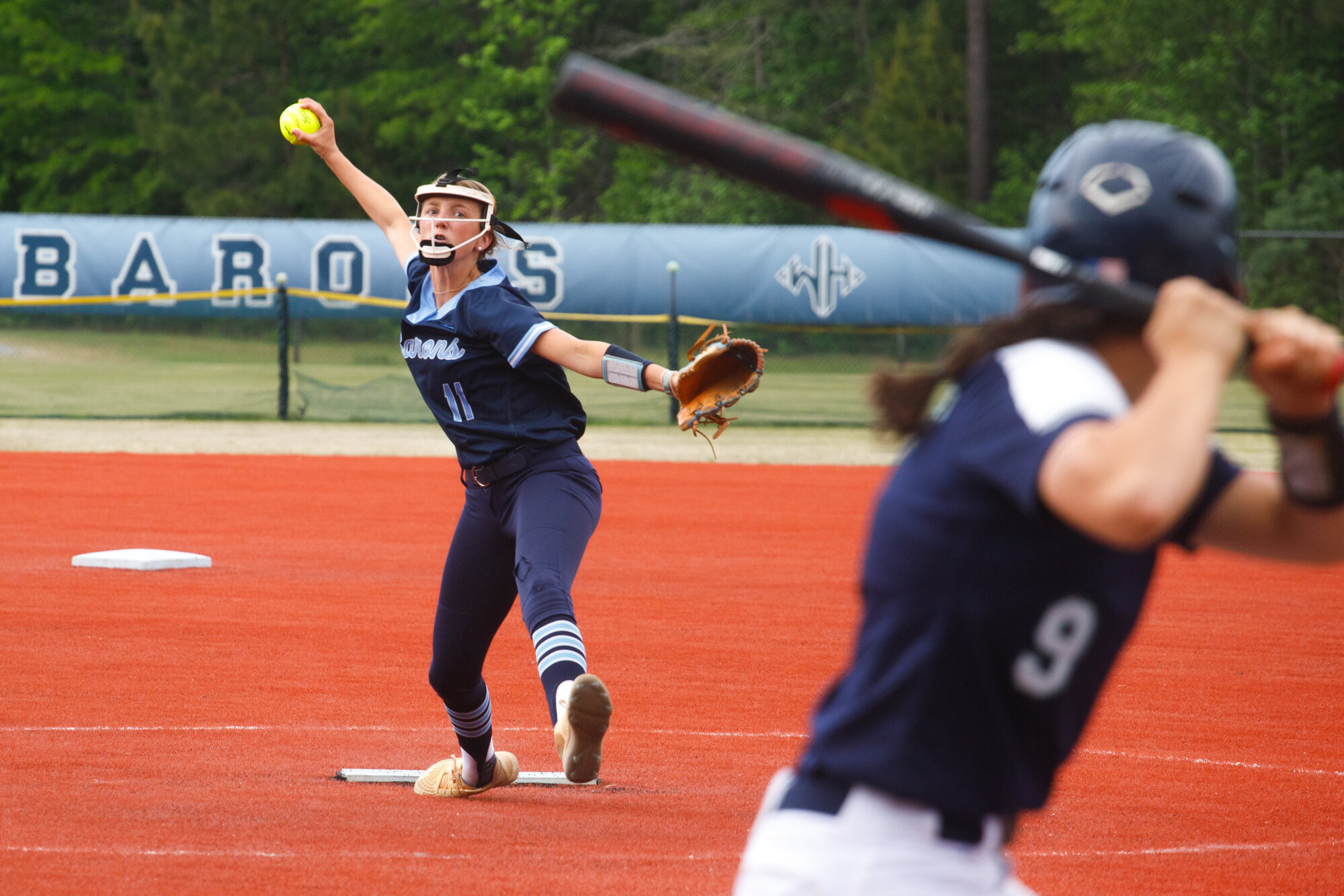 Wilson Hall's Marsha Kate Skey (11) pitches against Heathwood Hall at Patriot Park on April 23.